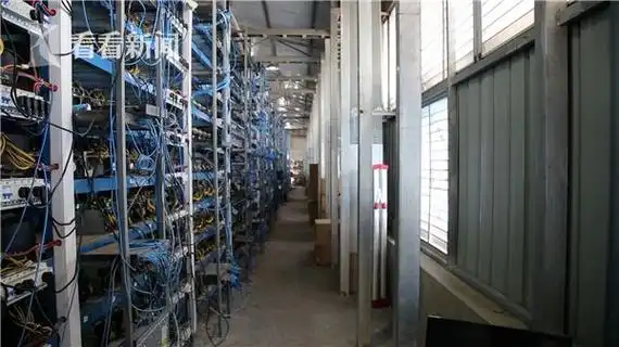 A large-scale mining farm with rows of mining rigs